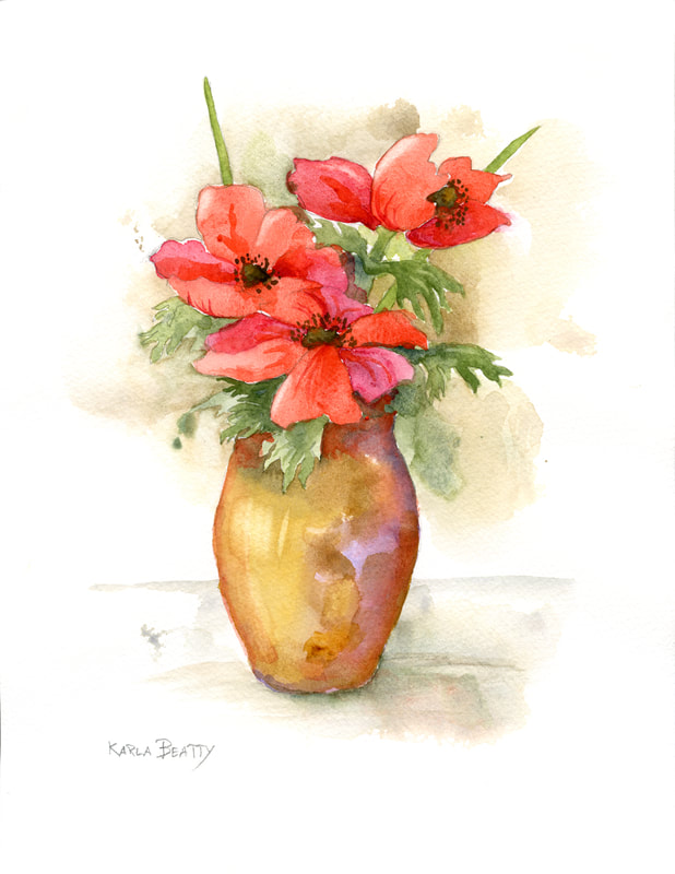 A bouquet of three red anemone blossoms in an amber color vase.